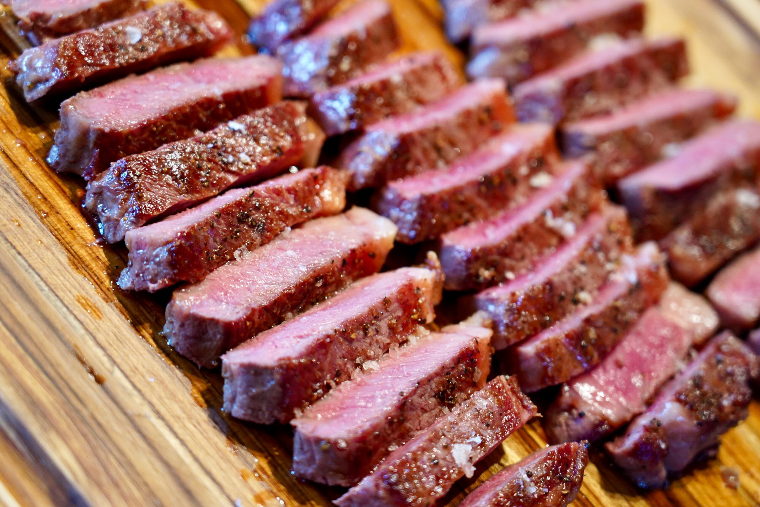 Sliced TruWagyu Steaks premium Wagyu beef from Old Three Wagyu, showcasing rich marbling and high-quality American Fullblood Wagyu beef.